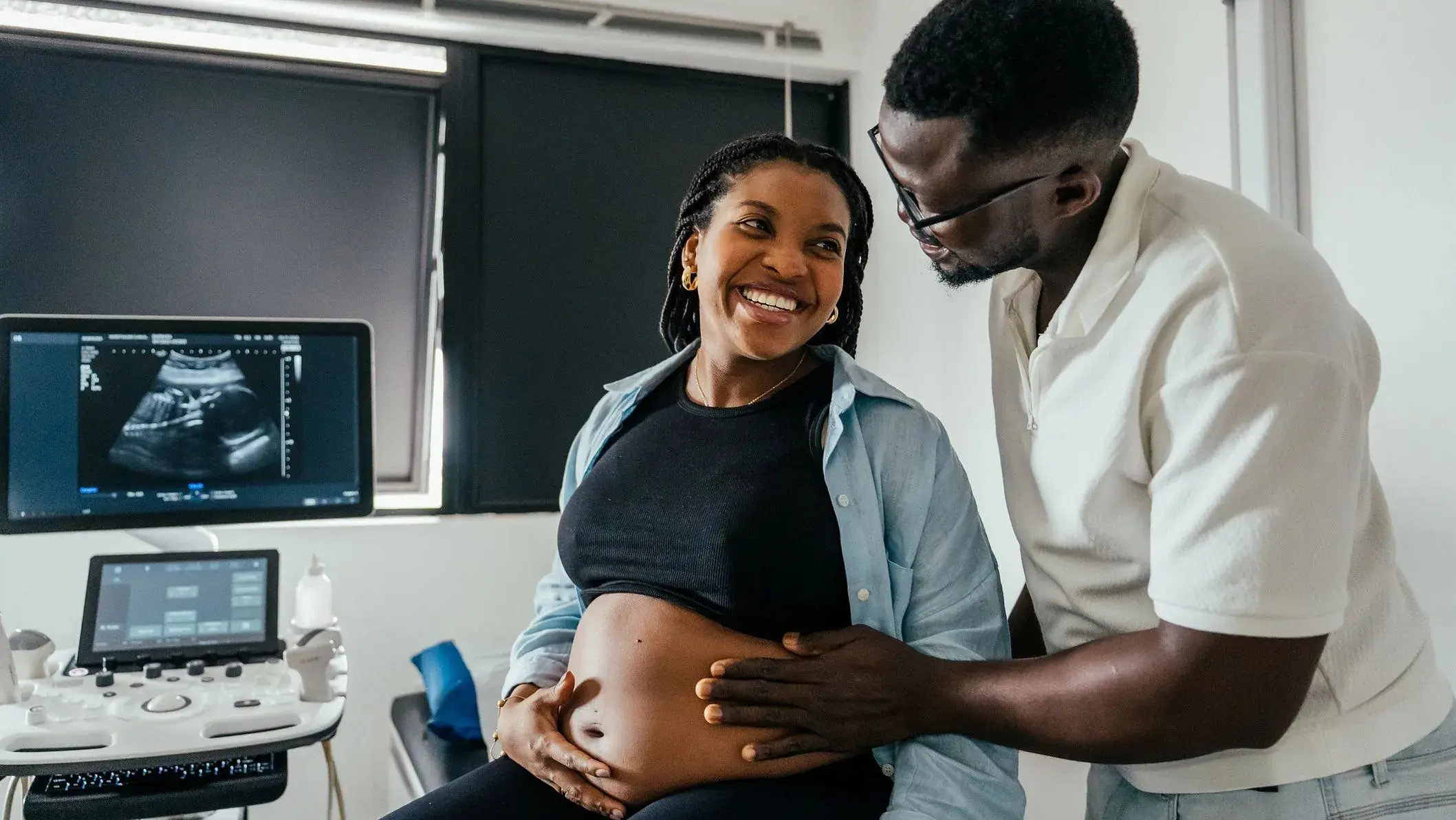Expectant couple sharing a quiet moment during pregnancy