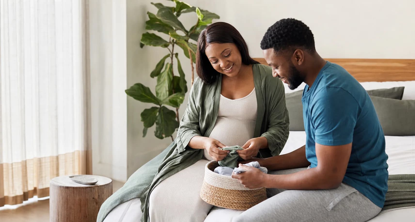 Expectant parents preparing for their baby together